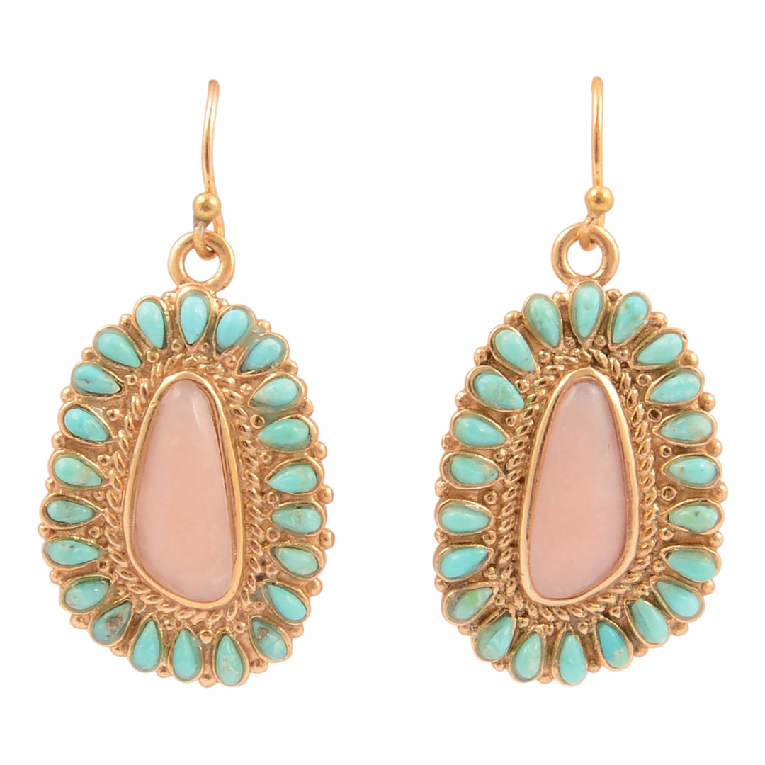Pair of gold-framed earrings with pink center and turquoise stones on a white background