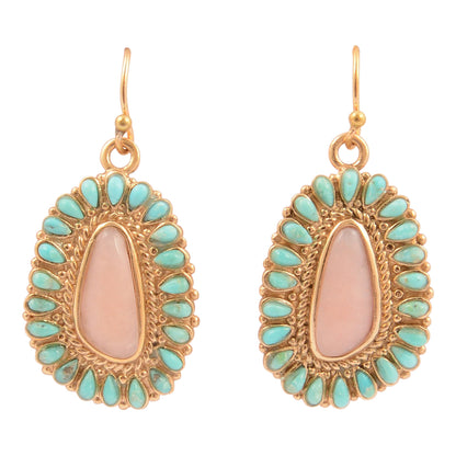 Pair of gold-framed earrings with pink center and turquoise stones on a white background