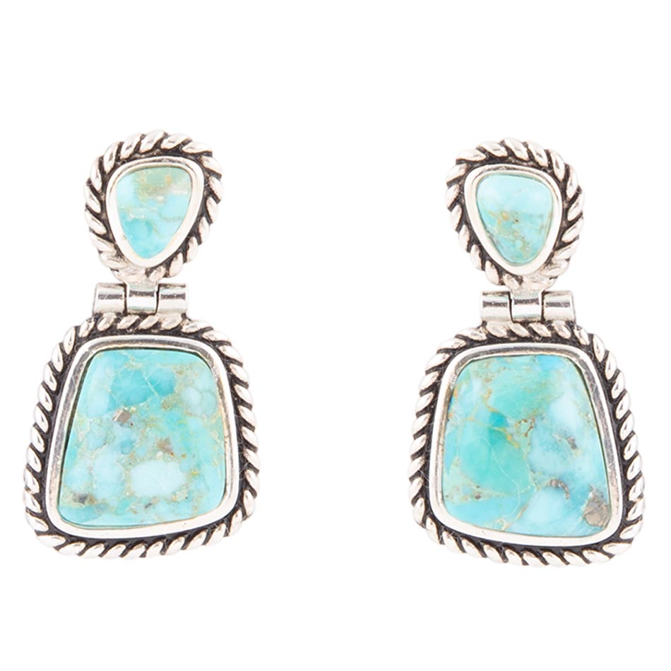 Turquoise stone earrings with silver frames on a white background