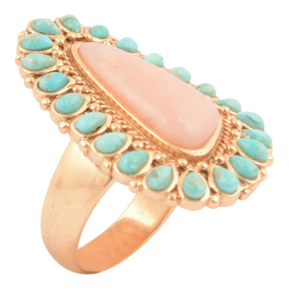 Ring with pink stone and turquoise stones on a white background