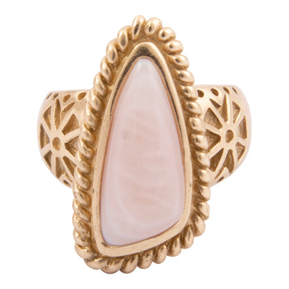 Gold ring with a large white stone on a white background