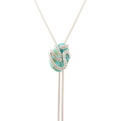 A silver-toned lariat necklace featuring a central turquoise and green marbled bead pendant with silver pavé accents, suspended on a fine silver chain against a solid white background.