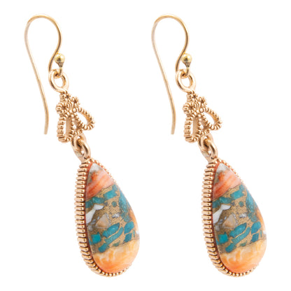 Teardrop-shaped earrings with gold wire wrapping and colorful stone beads on a white background