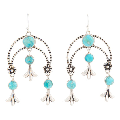 Turquoise stone and silver earring set on a white background