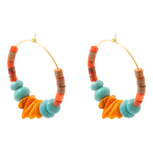 A pair of gold-tone hoop earrings featuring a series of colorful beads, including turquoise blue, orange, and brown cork-like accents, on a plain white background.