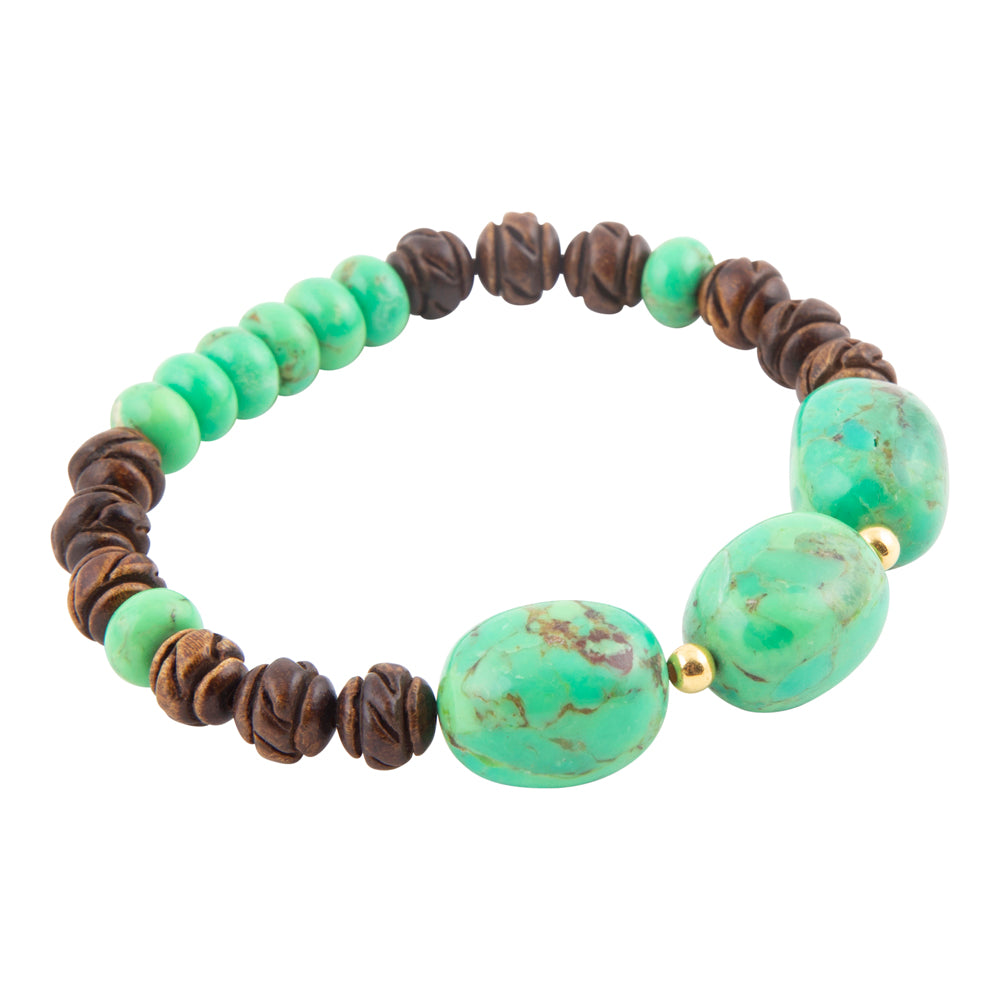 A beaded stretch bracelet featuring round turquoise-green beads and textured dark brown wooden beads, accented by three larger polished turquoise-green oval beads and small gold spacer beads, shown on a plain white background.