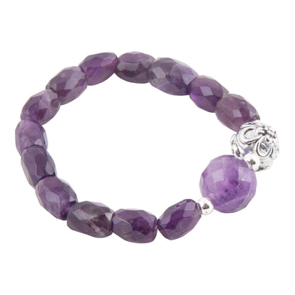 A purple faceted gemstone beaded bracelet with a silver-toned decorative accent bead, shown on a plain white background.