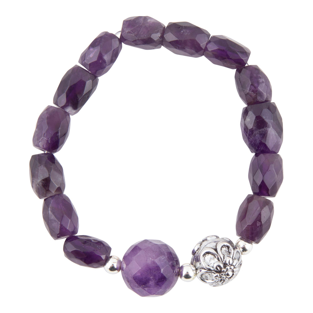 Faceted purple gemstone beaded stretch bracelet with a large polished oval bead and a silver filigree accent charm, shown on a plain white background.