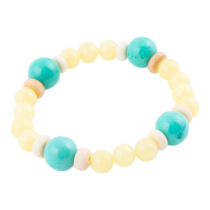 A beaded stretch bracelet featuring large turquoise-blue beads, pale yellow round beads, small white spacer beads, and a few natural wood beads, shown on a plain white background.
