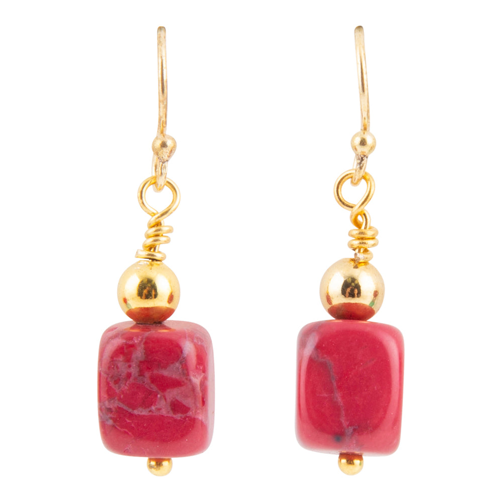A pair of gold drop earrings featuring square pinkish-red stone beads with natural white and dark veining, suspended from gold fishhook wires and polished gold beads.