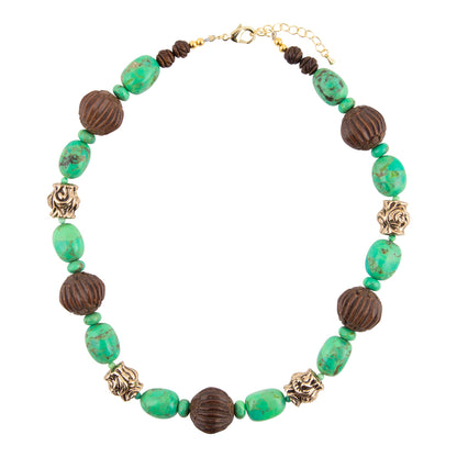 A beaded statement necklace featuring textured dark brown wooden beads, polished turquoise-green oval beads, and antique gold-toned filigree spacers, displayed on a clean white background.