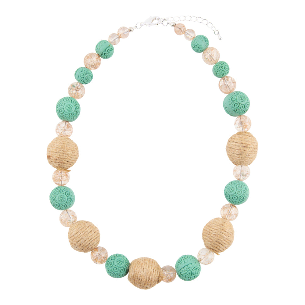 A beaded necklace featuring textured turquoise-green and natural tan beads, accented with clear faceted crystal beads, displayed on a solid white background.