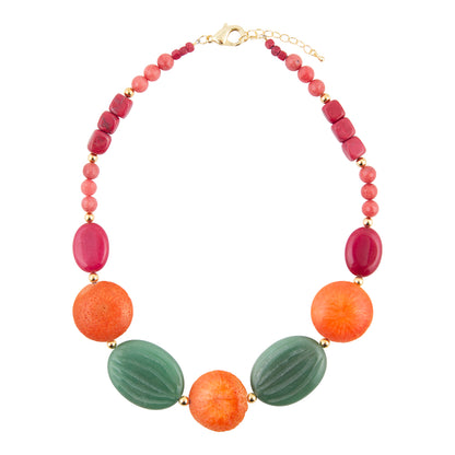 A colorful beaded necklace featuring large textured orange and green beads, smaller pink and red beads, and gold spacer rings, displayed on a clean white background.