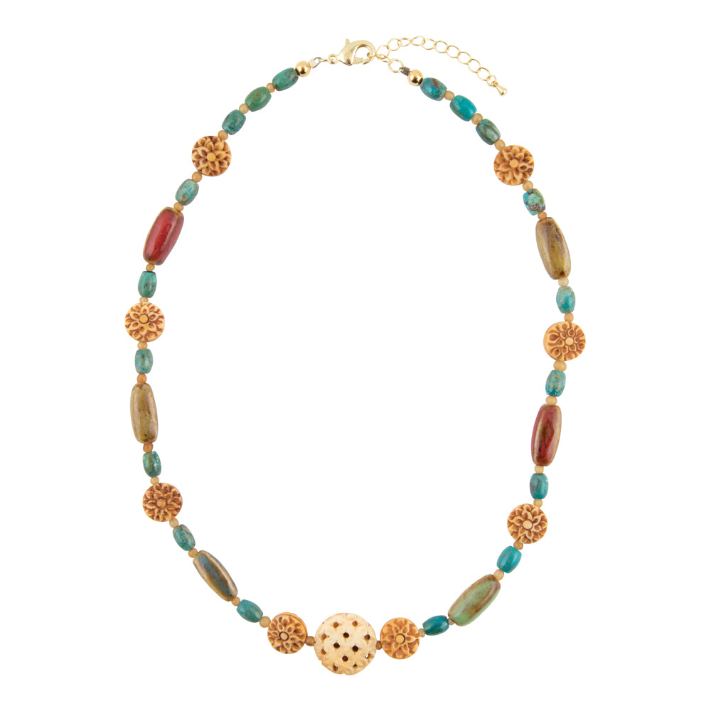 A bohemian-style beaded necklace featuring turquoise, olive green, and reddish-brown beads with textured gold spacer elements and a central gold bead with black dots, displayed on a clean white background.
