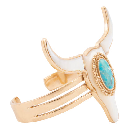 Gold and white horned cuff bracelet with turquoise stone on a white background