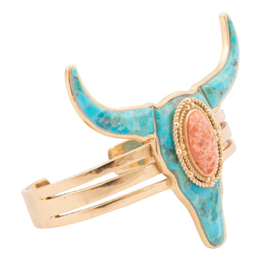 Turquoise and gold longhorn cattle skull bracelet on a white background