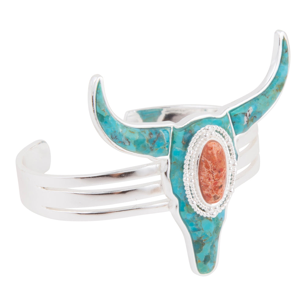 Turquoise and silver bull head-shaped cuff bracelet on a white background