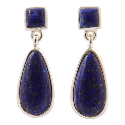 A pair of silver drop earrings featuring square-cut dark blue lapis lazuli stones at the top and larger teardrop-shaped lapis lazuli stones below, set in silver bezels on a white background.