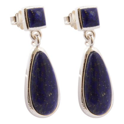 A pair of silver drop earrings featuring square lapis lazuli stones at the top and teardrop-shaped lapis lazuli stones below, set in polished silver bezels on a white background.