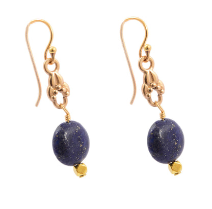 Gold earrings with blue stones on a white background