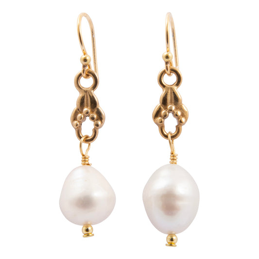 Pair of pearl earrings with gold hooks on a white background