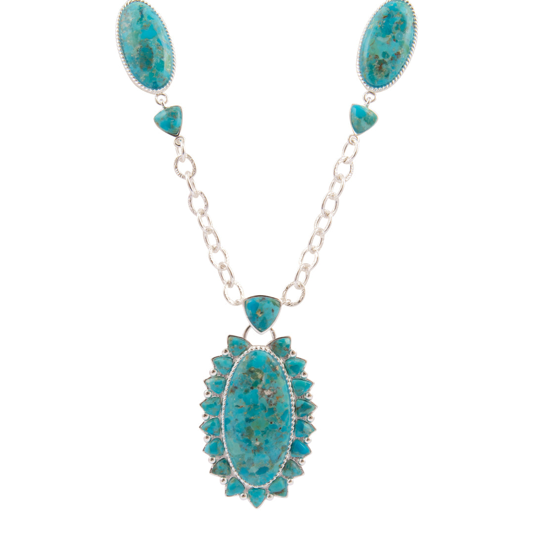 Turquoise necklace with silver chain on a white background