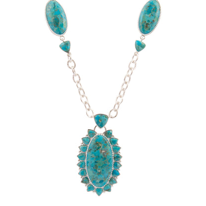 Turquoise necklace with silver chain on a white background