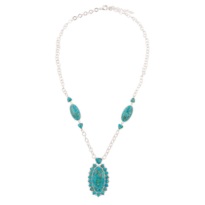 Turquoise necklace with silver chain on a white background