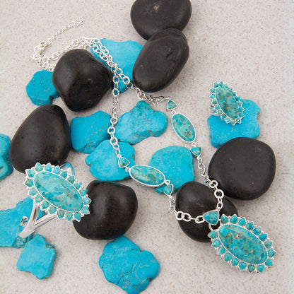 Necklace with turquoise stones on a background of black and blue stones
