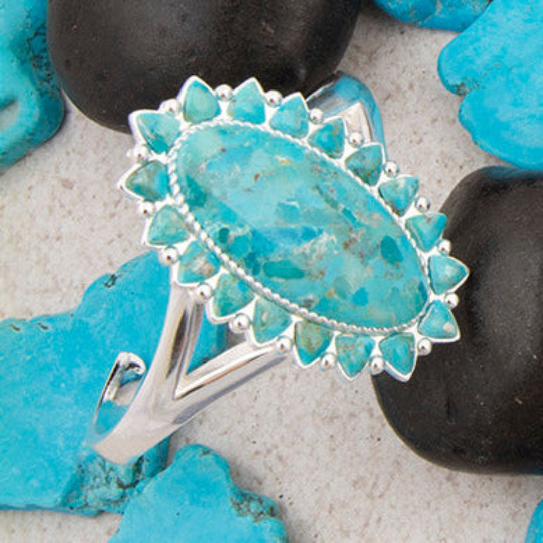 Necklace with turquoise stones on a background of black and blue stones