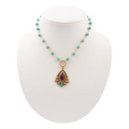 Necklace with a pendant on a mannequin bust against a white background