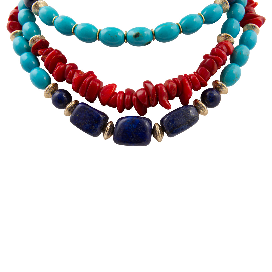 Stack of colorful beaded necklaces on a white background