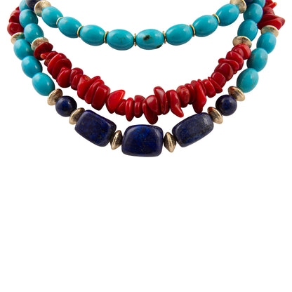Stack of colorful beaded necklaces on a white background