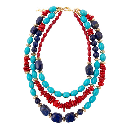 Stack of colorful beaded necklaces on a white background