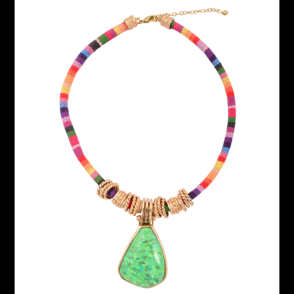 Colorful necklace with a green pendant on a white background