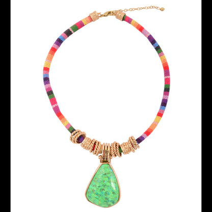 Colorful necklace with a green pendant on a white background