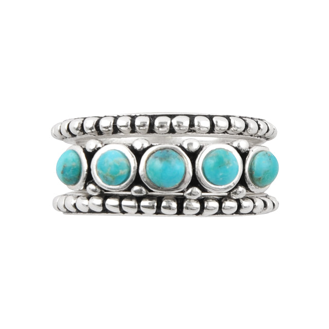 Stack of silver rings with turquoise stones on a white background