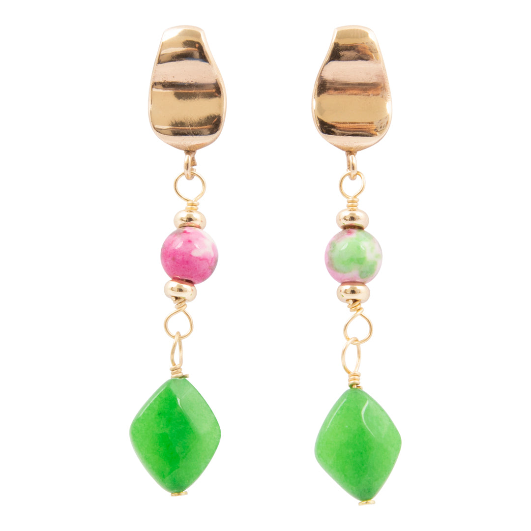 Pair of earrings with gold accents, pink and green beads on a white background