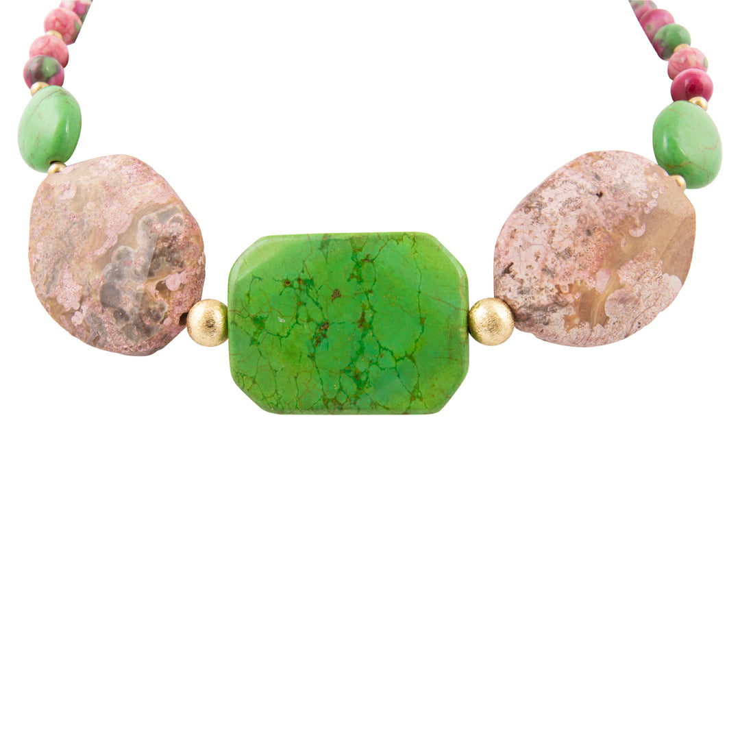 Necklace with natural stone and green bead on a white background