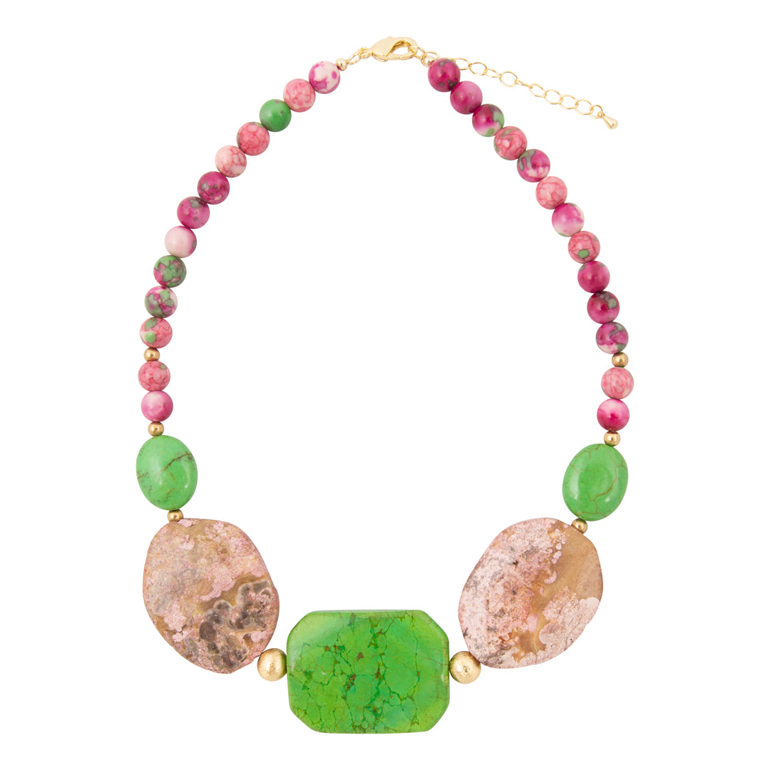 Necklace with multicolored beads and stones on a white background