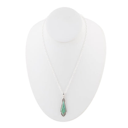Necklace with a green pendant on a white background
