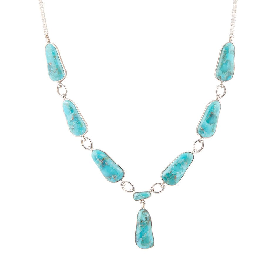 Turquoise stone necklace on a white background