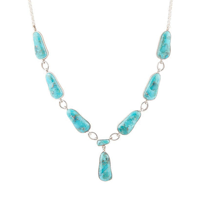 Turquoise stone necklace on a white background