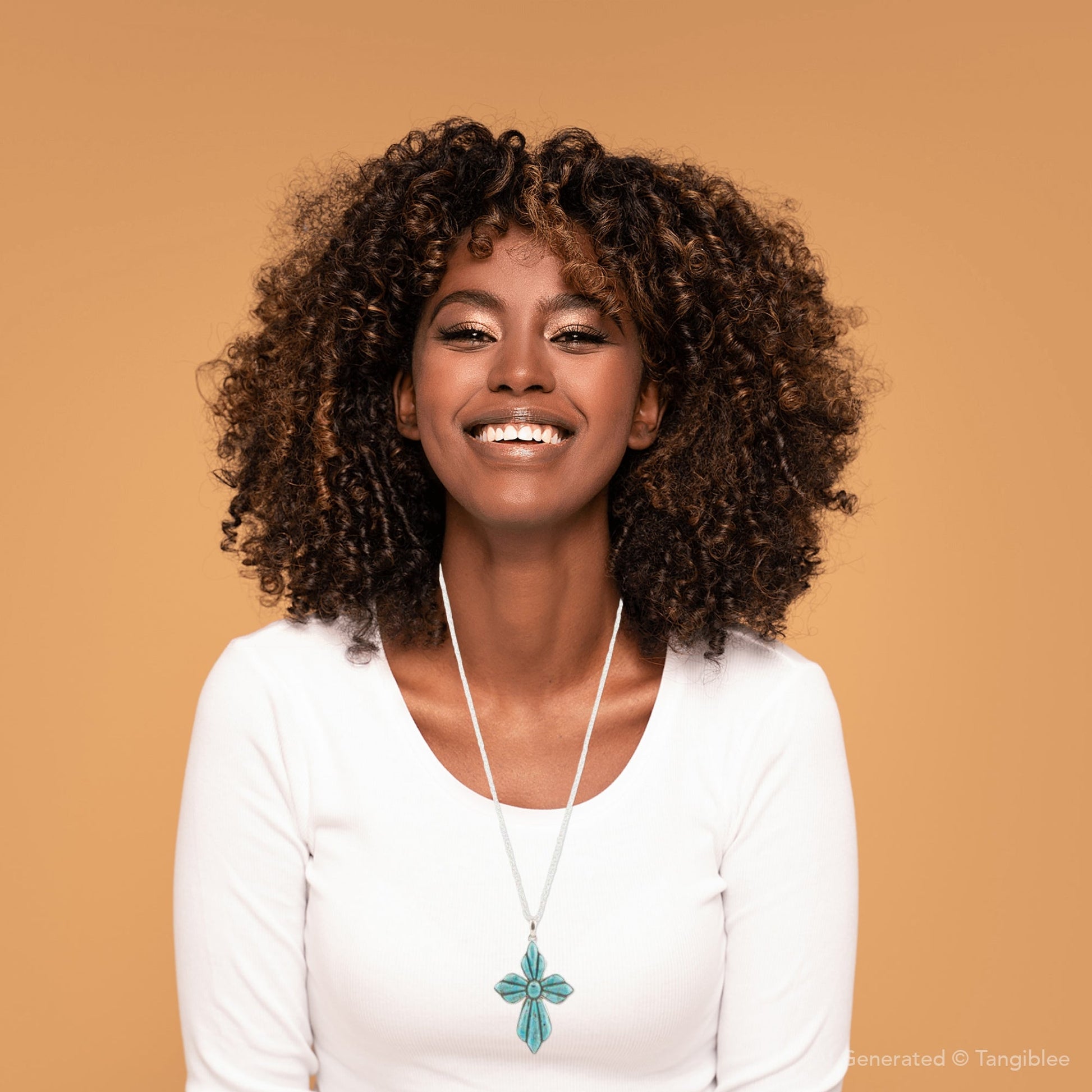Woman wearing a white shirt and turquoise necklace against a beige background