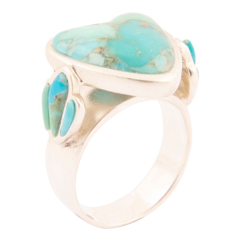 Ring with turquoise stones on a white background