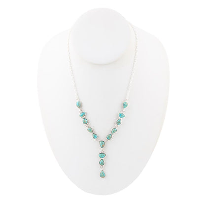 Turquoise necklace on a white mannequin bust