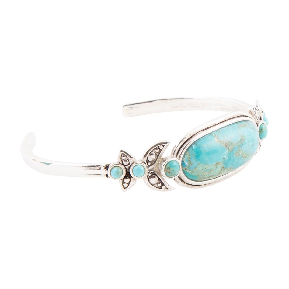 Turquoise stone bracelet with silver accents on a white background