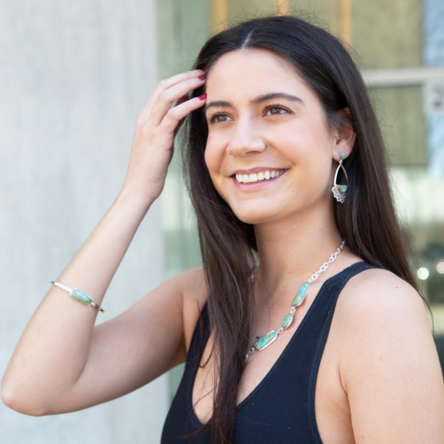 Woman wearing jewelry with a blurred background
