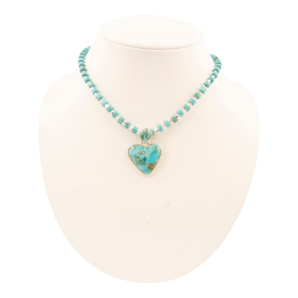 Turquoise necklace with a heart-shaped pendant on a white background