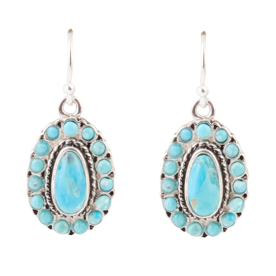 Turquoise stone earrings with silver frames on a white background